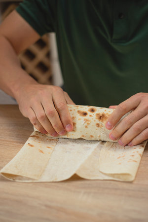 Man cooking homemade falafel in pita.の写真素材
