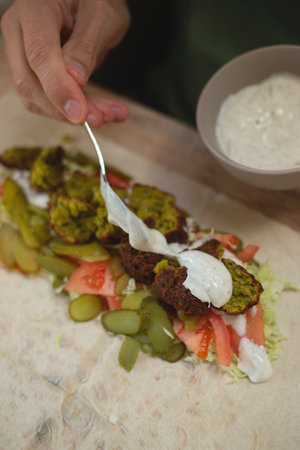 Man cooking homemade falafel meal.の写真素材