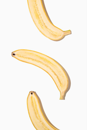 Half of a bananas on white isolated background.の写真素材