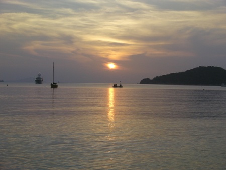 Sunset over Ocean with Boats の写真素材