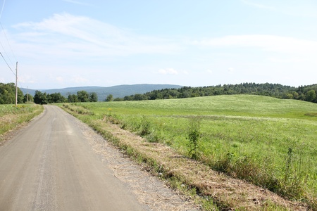 Country Side Road with Green Hillの写真素材