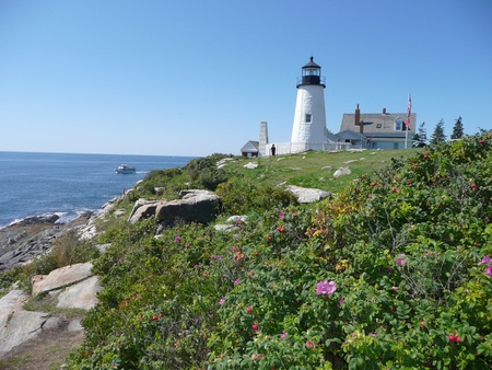 Lighthouse Beside Ocean with Blue Skyの写真素材