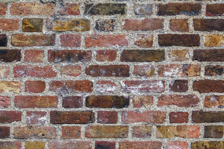Aged dark red brick wall texture