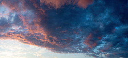 Blue sky background with tiny clouds. Dramatic sunset sky panoramaの写真素材