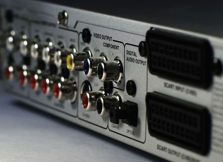 DVD player back connectors panel view from right side on grey surface, selective focusの写真素材