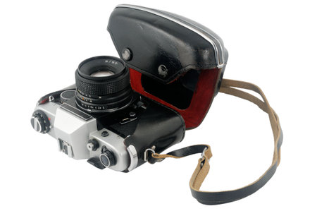 Old reflex 35mm film camera isolated on white