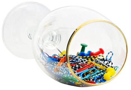 Colored stationery in beer glass isolated on whiteの写真素材