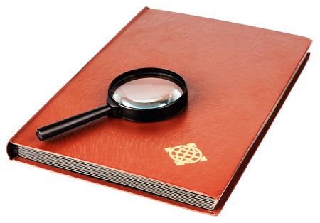 Postage stamp album and magnifying lens isolated on the whiteの写真素材