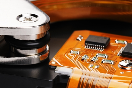 Taken apart computer hard disk drive (HDD) backgroundの写真素材