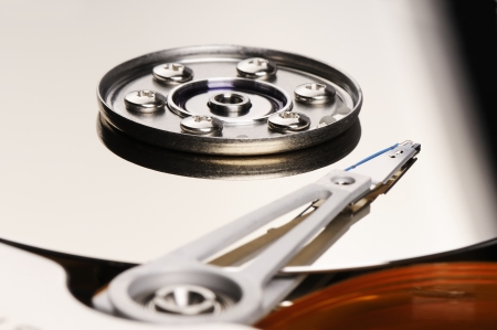 Taken apart computer hard disk drive (HDD) backgroundの写真素材