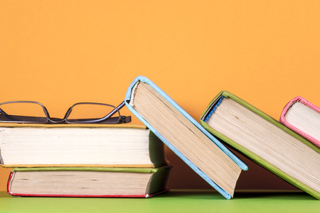 Open book, hardback bookson bright colorful background.の写真素材