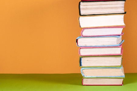 Open book, hardback bookson bright colorful background.の写真素材