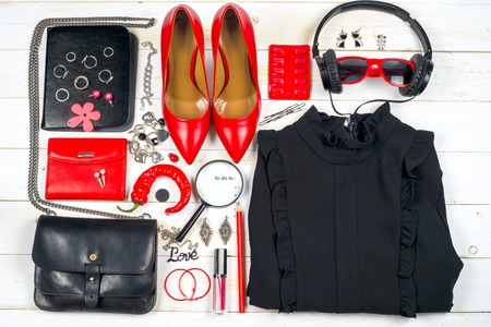 Women clothing set and accessories on white wooden background.の写真素材