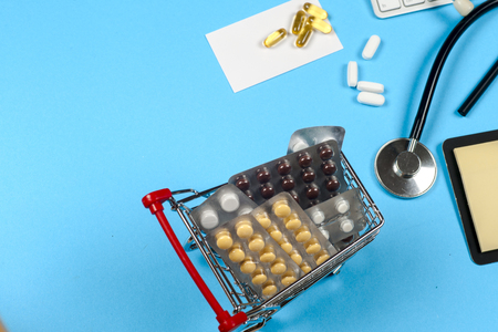 Medical report with pills and a stethoscope.の写真素材