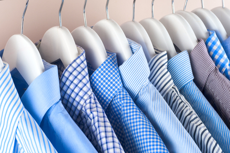 Cloth Hangers with Shirts. Mens clothesの写真素材