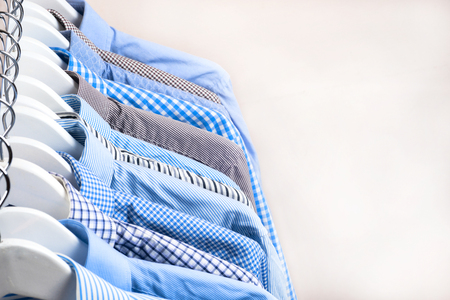 Cloth Hangers with Shirts. Mens clothesの写真素材