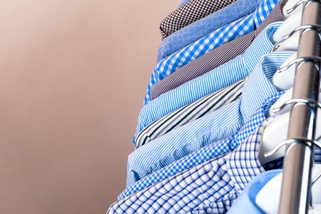 Cloth Hangers with Shirts. Mens clothesの写真素材