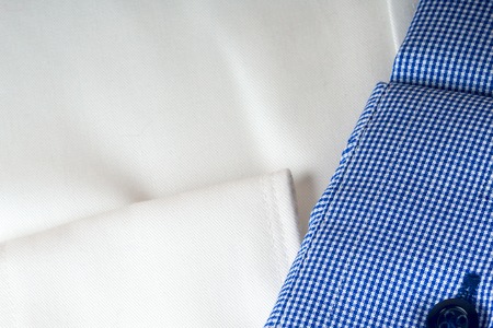 Stack of blue and white shirt closeupの写真素材