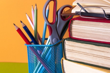 Open book, hardback books on bright colorful background.の写真素材