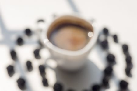 Various fresh summer berries, cup of coffee on natural background.の写真素材