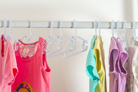 Set of clothes for kids on hangers. Shopping.の写真素材