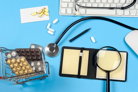 Medical report with pills and a stethoscope.の写真素材