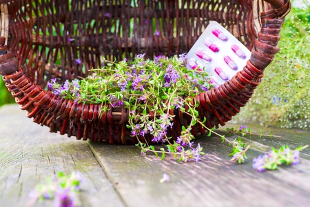 Alternative Medicine.Thyme and medical ampoules. Essential oilsの写真素材