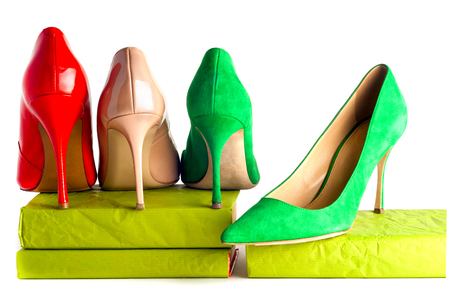 bright, multicolored female shoes on high heels isolated on white background.の写真素材