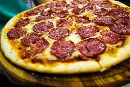 Eating Food. Close-up Of People Hands Taking Slices Of Pepperoni Pizza.の写真素材
