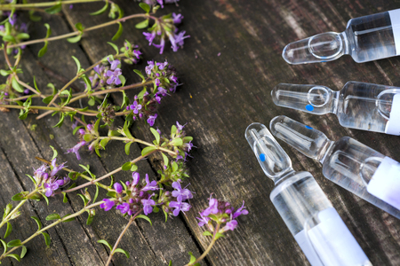Alternative Medicine.Thyme and medical ampoules. Essential oilsの写真素材