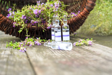 Alternative Medicine.Thyme and medical ampoules. Essential oilsの写真素材