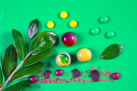 Top view of set of beautiful and delicious chocolate sweets decorated with assorted chocolate crumbsの写真素材