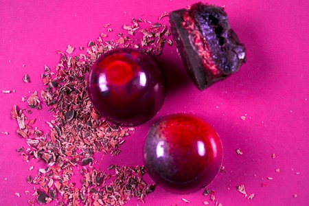 Top view of set of beautiful and delicious chocolate sweets decorated with assorted chocolate crumbsの写真素材