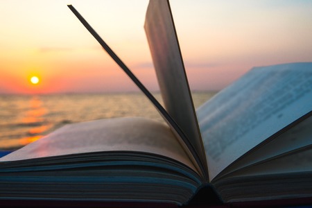 Book on the beach. Back to schoolの写真素材