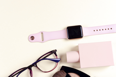 Womans cosmetics and accessories on wooden background. Beautiful make up bag with cosmeticsの写真素材