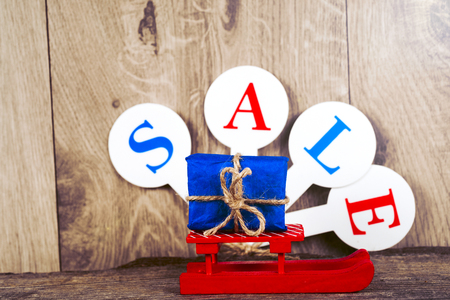 Conceptual photo of Christmas sales or gift shopping. The word SALEの写真素材