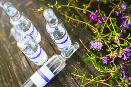 Alternative Medicine.Thyme and medical ampoules. Essential oilsの写真素材