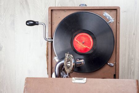 Vinyl record player, bright lights disco-bokeh. Needle on vinyl record.の写真素材