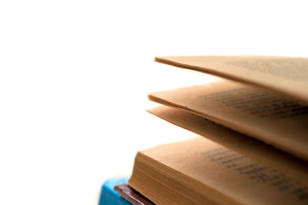 Open book, hardback books on bright colorful background.の写真素材