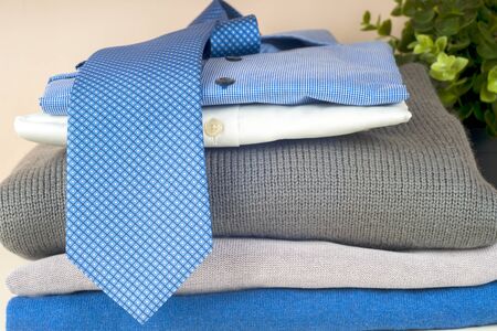 Stack of blue and white shirt closeup on a light background.の写真素材