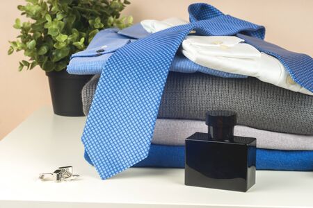 Stack of blue and white shirt closeup on a light background.の写真素材