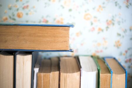 Open book, hardback books on bright colorful background.の写真素材