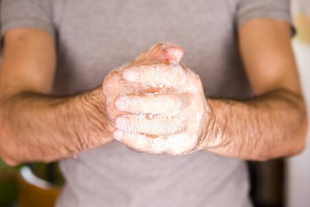 Washing hands rubbing with soap man for corona virus prevention, hygiene to stop spreading coronavirusの写真素材