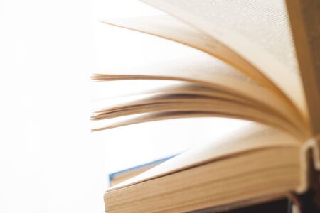 Open book, hardback books on bright colorful background.の写真素材