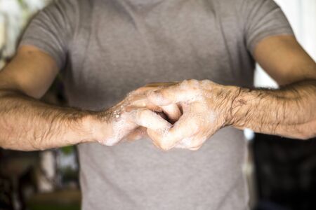 Washing hands rubbing with soap man for corona virus prevention, hygiene to stop spreading coronavirusの写真素材
