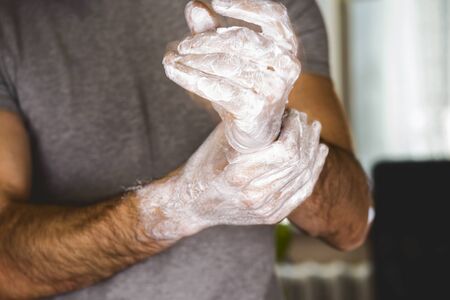 Washing hands rubbing with soap man for corona virus prevention, hygiene to stop spreading coronavirusの写真素材