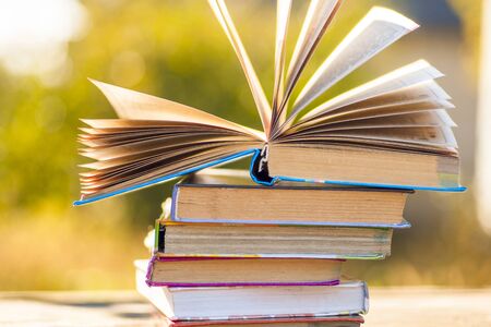 Open book on wooden table on natural background. Soft focusの写真素材