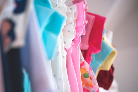 Set of clothes for kids on hangers. Shopping.