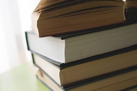 Open book, hardback books on bright colorful background.の写真素材