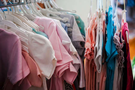 Set of clothes for kids on hangers. Shopping.の写真素材